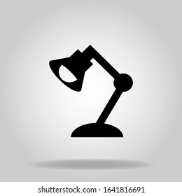 Logo or symbol of desk lamp icon with black fill style
