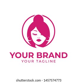 logo template of beautiful woman face and hair pink color in circle