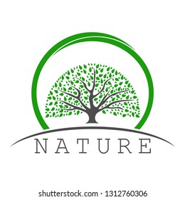 The logo of the tree with a large lush crown. The image of the trunk, green leaves on the background of the horizon in a round frame. Below the horizon line is an inscription, slogan or company name.