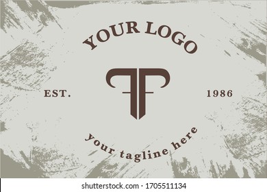 Logotype lettering T and F. Shield in the form of the bull
