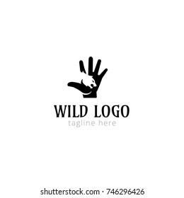 Logotype wild logo for tattoo salon, magazines.  Predator in hand. Vector illustration logo