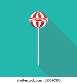 Lollipop flat style with long shadow isolated on green background. Sweets vector sign symbol