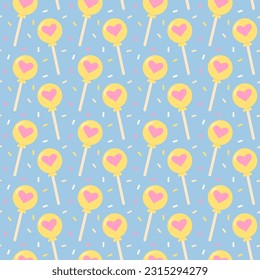 Lollipop with heart seamless pattern on blue background. Cute print. Trendy pastel wrapping paper.