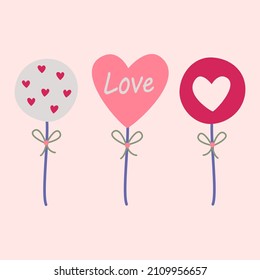 Lollipops on a stick in the shape of hearts. Vector image in boho style. valentine's day. A greeting card with a declaration of love.