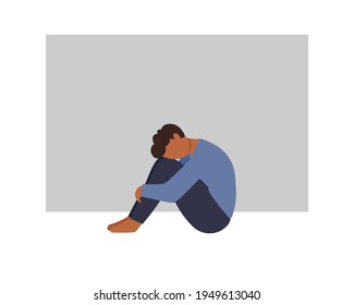 A lonely  african man sitting and hugging his knees. Young depressed male character. Sad thoughts. Depressed man concept. Vector illustration in flat style