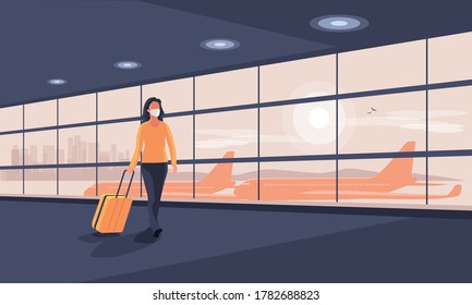 Lonely Business Woman Traveler Wearing Face Mask With Luggage Walking At Empty Airport Gate Terminal Lounge Traveling During Pandemic Outbreak. Airplanes Behind Glass Window With City Skyline Sunset.