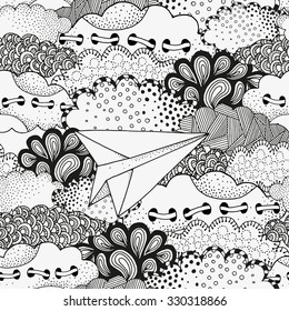 Lonely paper airplane flying in the sky. Art background with vector abstract artistically clouds. Pattern for coloring book. Made by trace from sketch. Ink pen. Zentangle. Black and white pattern.