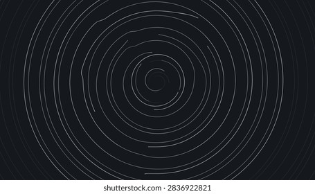 Long exposure star trails visual abstract background with white circular lines radiating from central point over dark cosmic night sky.
