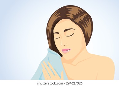 Long hair women wipe wet hair to dry with blue towel on blue background