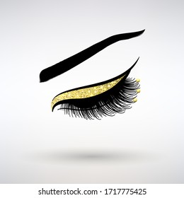 long lashes with gold decor on a light background