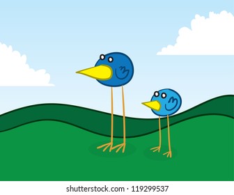 Long legged birds standing in the grass