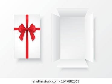 The long white gift box is opened and the lid is tied with a bow and a red ribbon placed on a white background, used for containing things.