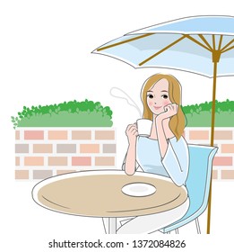 Long-haired woman relaxing in a cafe with umbrellas