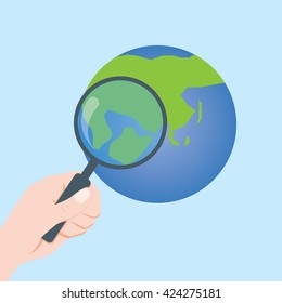 look at the earth with magnifying glass-vector