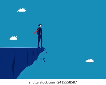 Look firmly at the future. Confident businessman standing on the edge of a cliff and looking ahead