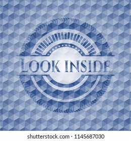 Look inside blue badge with geometric pattern background.