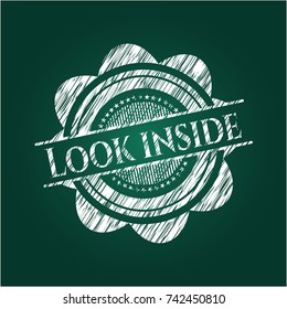 Look inside chalk emblem written on a blackboard