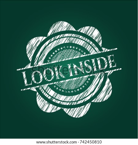 Look inside chalk emblem written on a blackboard