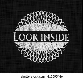 Look inside chalkboard emblem written on a blackboard