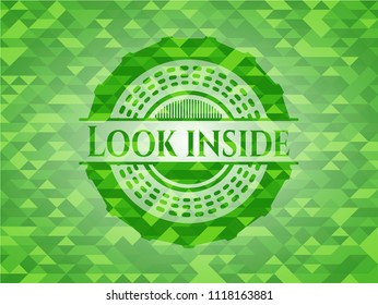 Look inside green emblem with triangle mosaic background