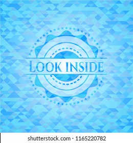 Look inside light blue emblem with triangle mosaic background