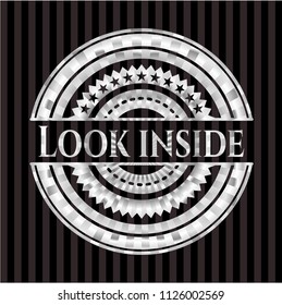 Look inside silvery shiny badge