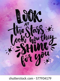 Look at the stars, look how they shine for you. Inspirational quote at violet and pink watercolor background.