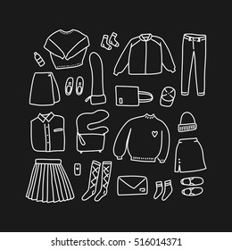 Lookbook doodles in black and white. Set of hand drawn women clothes in linear style (flat lay / top view)