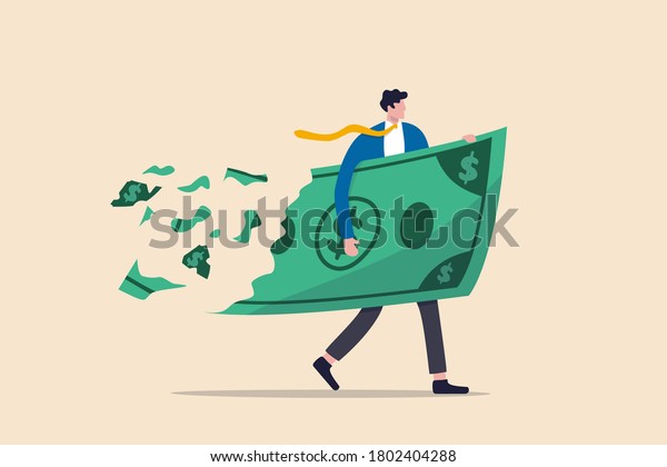Lose money investment in financial crisis, profit\
and loss in business or deflation and inflation concept,\
businessman holding big dollar banknote money while loss, crumble\
and reduce in value.
