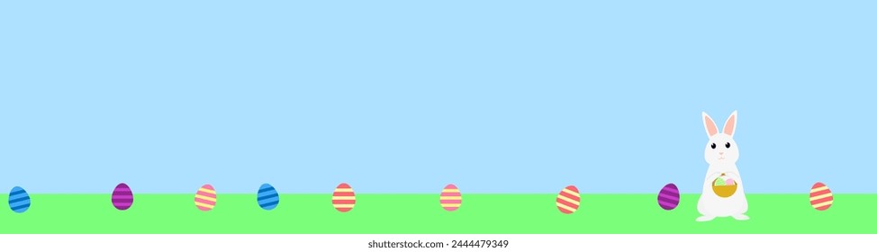 Lots of Easter eggs laying on the grass. Easter bunny holding a basket with eggs.