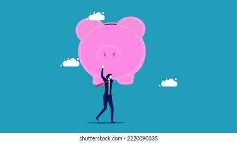 Lots of money. businessman trying to hold a big piggy bank