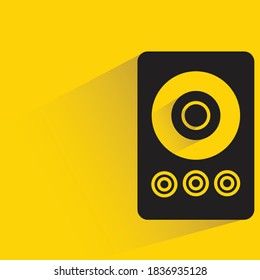 loudspeaker with drop shadow on yellow background