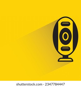loudspeaker with shadow on yellow background