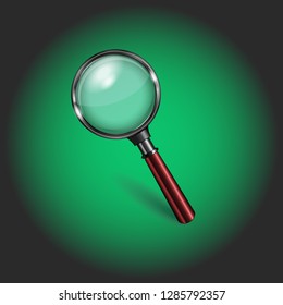 loupe with red handle on green background