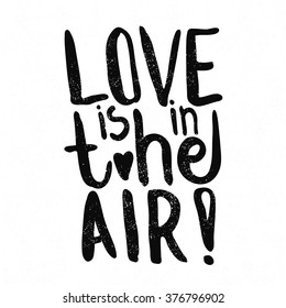 Love is in the air. Black and white lettering. Decorative letter. Hand drawn lettering. Quote. Vector hand-painted illustration. Decorative inscription. Font, motivational poster. Vintage illustration