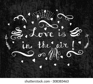 Love is in the air Calligraphic lettering, grunge style Hand drawn typography poster. Romantic quote for valentines day card or save the date card. Inspirational vector typography. White on blackboard