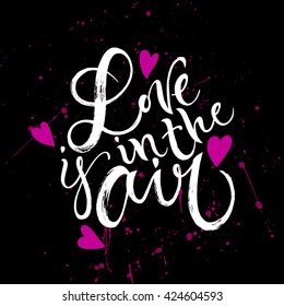 Love is in the air card. Hand drawn lettering. Modern calligraphy. Ink illustration. Design for banner, poster, card, invitation, flyer, brochure, t-shirt. Isolated on textured black background