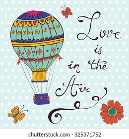 Love is in the air. Hand drawn card with air ballooons and handwritten words