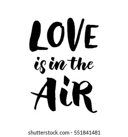 Love is in the air hand drawn text calligraphy for Valentine Day greeting card. Black calligraphic vector font on white background. Happy Valentines 14 February heart love congratulation art design