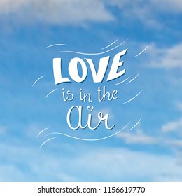 Love is in the air.
Hand lettering.
Blue sky background.
Vector illustration