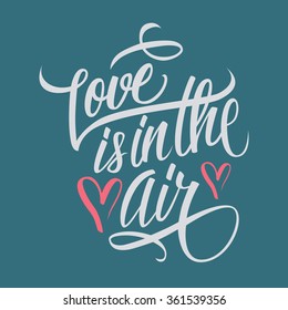 Love is in the air hand lettering. Hand drawn card design. Handmade calligraphy. Vector illustration.