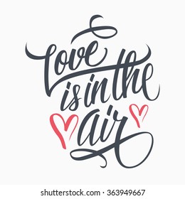 Love is in the air hand lettering. Hand drawn card design. Handmade calligraphy. Vector illustration.