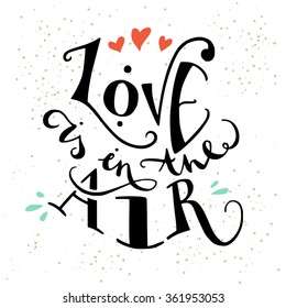 'Love is in the air' hand lettering inspirational quote. Can be used as wedding element or save the date card design.