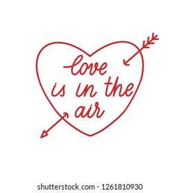 Love is in the air hand lettering vector on red heart.