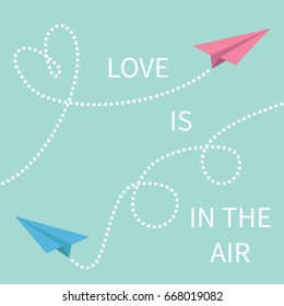 Love is in the air Lettering text. Two flying origami paper plane Dashed line Heart loop Happy Valentines day Greeting card Typographical blue sky background with quote Flat design Vector illustration