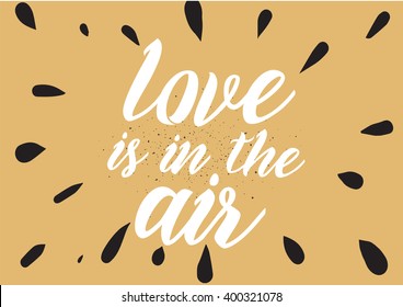Love is in the air romantic inscription. Greeting card with calligraphy. Hand drawn lettering design. Photo overlay. Typography for banner, poster or apparel design. Vector typography.