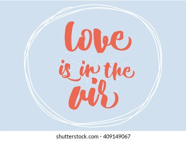 Love is in the air romantic inscription. Greeting card with calligraphy. Hand drawn lettering design. Typography for banner, poster or clothing design. Vector invitation.