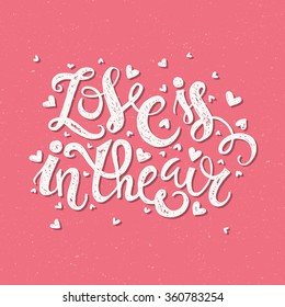 Love is in the air - vector hand lettering. Perfect poster or card design. Typographic vector. 