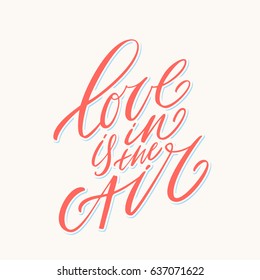 Love is in the air. Vector lettering phrase.