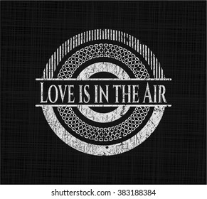 Love is in the Air written on a chalkboard